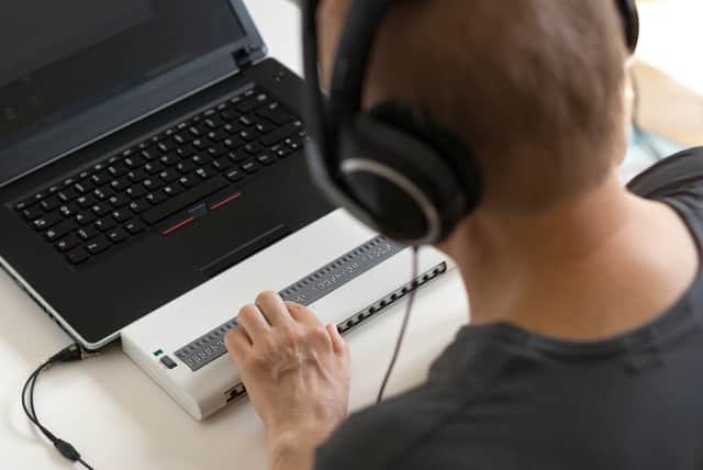 <p>Global Accessibility Awareness Day focuses on digital access and inclusion for people with disabilities or impairments. (Image shows visually impaired person working on computer with assistive technology) </p>