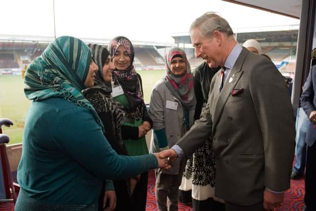 Charles, at Turf Moor in 2010, speaks to young people who have participated in programmes run by the Prince’s charities