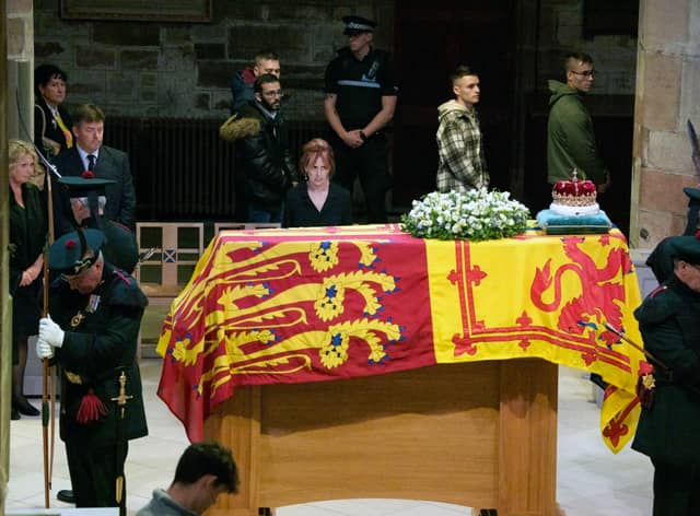 Members of the public file past the coffin of Queen Elizabeth II in St Giles' Cathedral, Edinburgh, as it lies at rest. Picture date: Monday September 12, 2022.