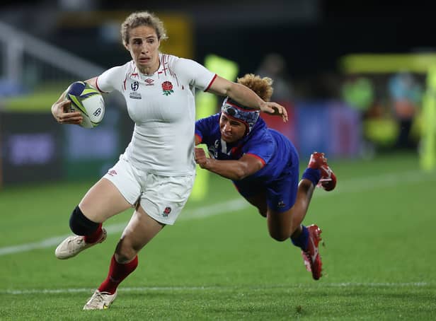 <p>Abby Dow of England is tackled during the Pool C Rugby World Cup 2021 match between France and England </p>