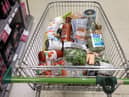 A shopping trolley is pictured at a Waitrose supermarket in London. 