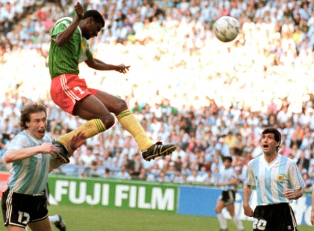 <p>Forward Francois Omam-Biyick from Cameroon scores with a header as Argentinian defenders Nestor Lorenzo (L) and Juan Simon look on during the opening match of Italia 90  (STAFF/AFP via Getty Images)</p>