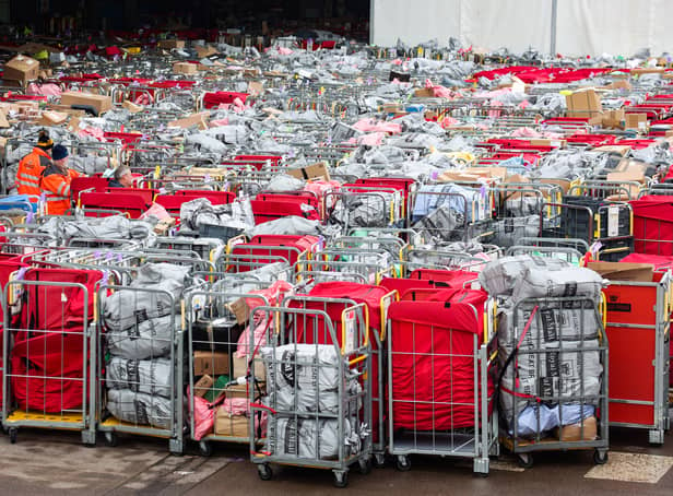 <p>Letter and parcels pile up outside the Royal Mail centre in Bristol. Due to the postal strike along with the busy festive period lots of cages are seen outside the mail centre. Many of these parcels have been left outside for at least 17 hours.</p>