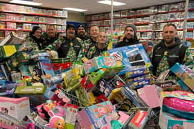 Reese, far right, and his team with some of hundreds of toys they bough from Smyth's Toy Shop