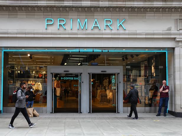 A pedestrian walks past a Primark store on Oxford Street.
