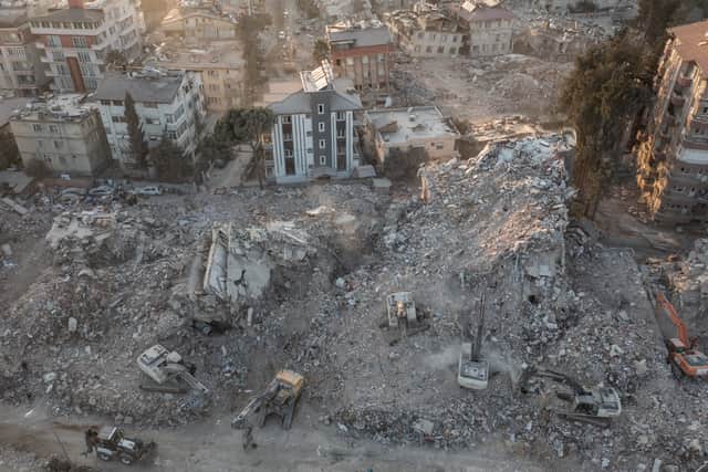 An aerial view of work machines and diggers at the site of collapsed buildings on February 16, 2023 in Hatay, Turkey