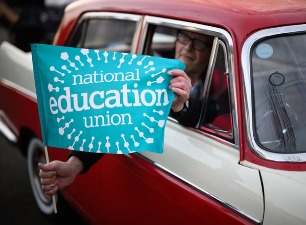 <p>A driver supporting the NEU strike action (Photo: Getty)</p>