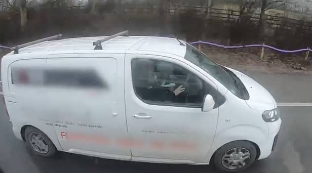 Motorists caught on camera watching a film while driving