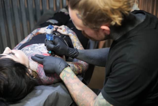 Adding to a woman's full body tattoo (photo: Barber DTS - Rebecca Lawton)