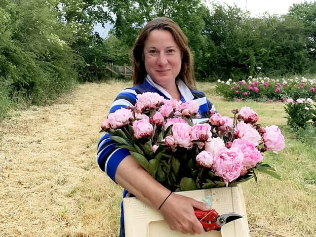 Elonor Tivey at her seven acre field in Leicestershire where she farms peonies. 