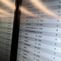 A screen shows cancelled flights at Milan Linate Airport in Milan, Italy on October 21, 2022 due to strike (Photo by Piero Cruciatti/Anadolu Agency via Getty Images)