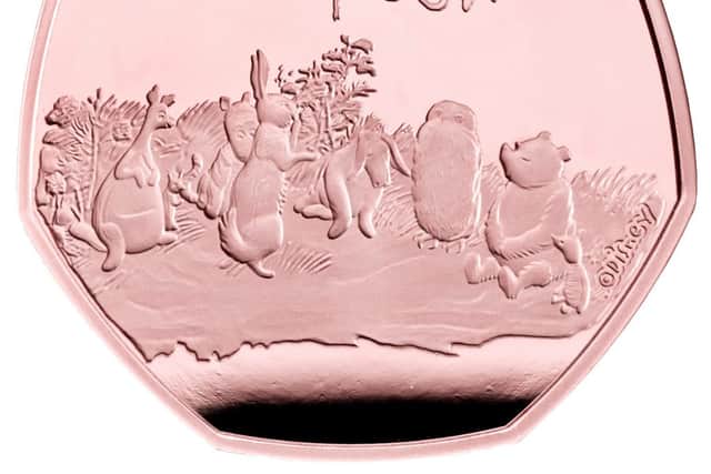 A new gold 50p collectable coin featuring Winnie-the-Pooh and Piglet, Owl, Eeyore, Rabbit, Tigger, Kanga and Roo