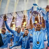 Fernandinho of Manchester City lifts the Premier League Trophy with team mates (Photo by Michael Regan/Getty Images)