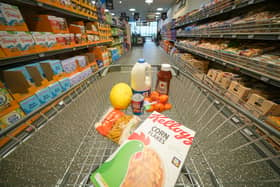 A shopping trolley filled with groceries from Aldi, which has been named the UK’s cheapest supermarket for 12 months in a row.