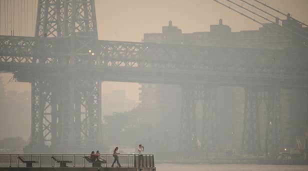 The New York city skyline and east river shrouded in smoke in Brooklyn as smoke from the hundreds of wildfires blazing in eastern Canada drifted south (Photo: Getty Images)