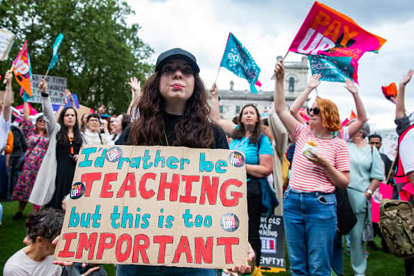 Striking teachers from the National Education Union (NEU) hold a rally in Parliament Square on 5 July 2023 in London, United Kingdom. NEU members are striking to win a fully-funded, above-inflation pay rise for all educators. (photo by Mark Kerrison/In Pictures via Getty Images)