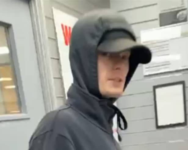 Officers want to identify this man after an armed robbery in Burnley (Credit: Lancashire Police)