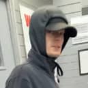 Officers want to identify this man after an armed robbery in Burnley (Credit: Lancashire Police)
