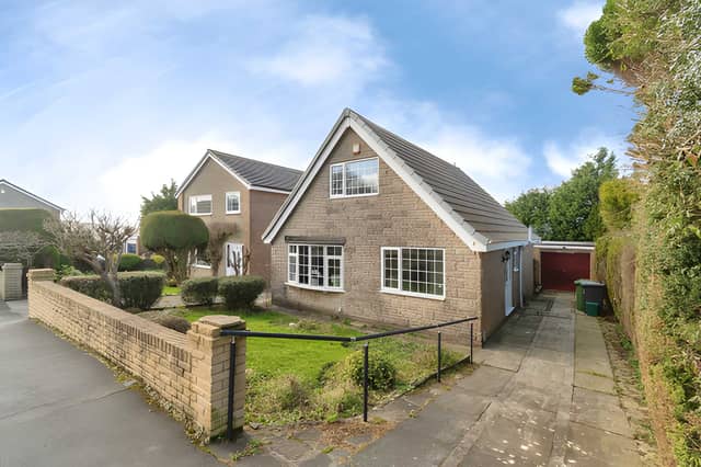 The Deerstone Road frontage leads to a detached three-bedroom home with driveway parking and a garage
