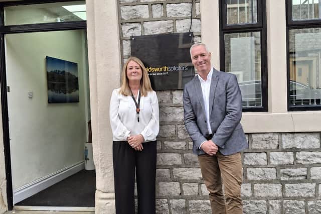Amanda Hall (Houldsworth) and Ian Liddle (Farleys) are stood outside Houldsworth Solicitors following Farleys’ recent acquisition of the business.