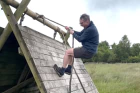 Bishop Philip does a trial run on the assault course in Barley before the main event this weekend