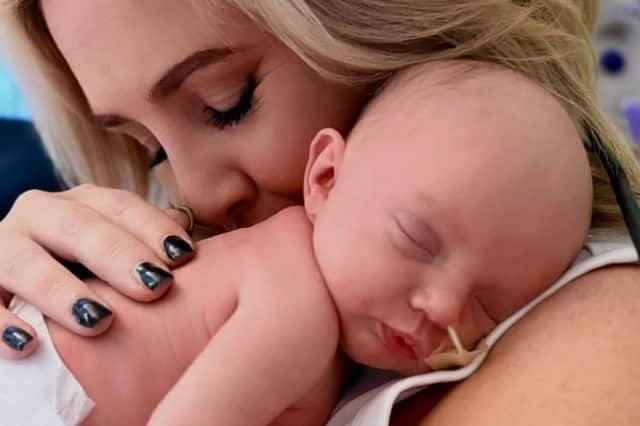 Tiny Arabella, pictured with her grandmother, Rebecca Jane Sutton, has amazed everyone with her fighting spirit after she was born with the condition gastroschisis, which means her bowel was outside her body at birth