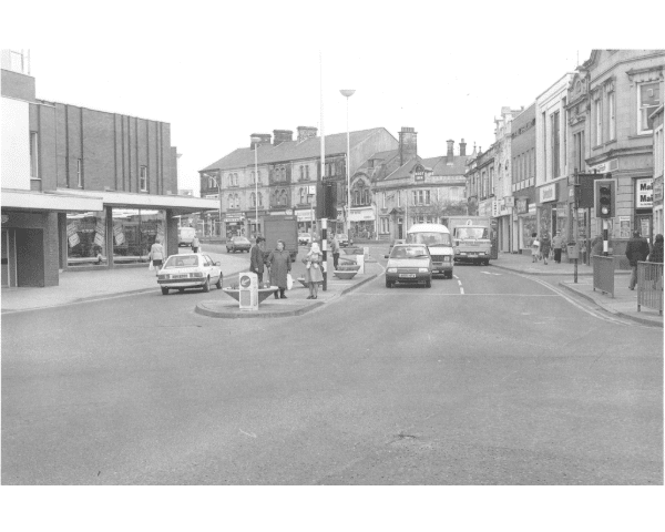 Photograph shows St. James's Street taken from the junction with Manchester Road, looking towards Church Street. The photograph was taken prior to the road becoming pedestrianised.