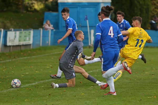 Luke Hepple scores Nelson's first goal against Ramsbottom United