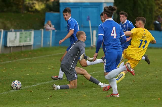Luke Hepple scores Nelson's first goal against Ramsbottom United