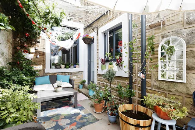 The walled courtyard frontage sets the scene for this characterful Mosley Street terraced house