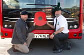 Transdev colleagues who are former Armed Forces personnel with a poppy in front of a bus, operated by Transdev, for the Poppy Appeal 2026 campaign renewal