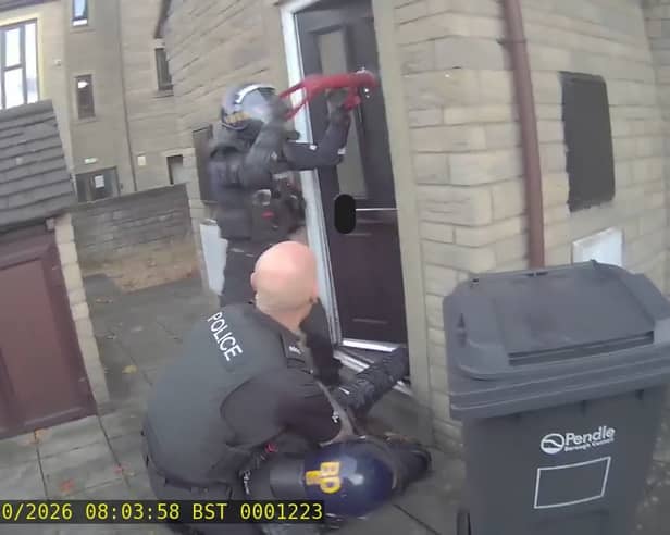 Police have seized £96,000 in cash and a quantity of cannabis plants in Nelson drugs raid