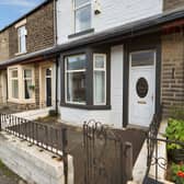 The mid-terrace property on Rossendale Road is offered for £115,000, with on-street parking available at the front.