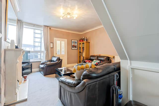 One of the two reception rooms could serve as a comfortable lounge, with a separate room available for dining or other uses.