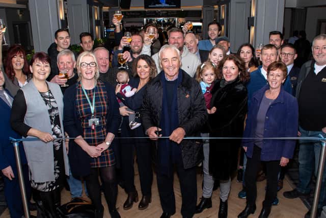 Former Burnley manager Stan Ternent performs the honours of cutting the ribbon at the re-opening of The Brun Lea pub in Burnley.