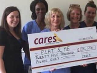 East Lancashire Hospitals Trust after being presented with a cheque for 25,000 from CARES