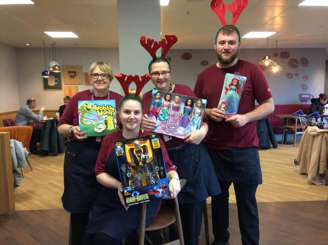 Staff at Costa Coffee in Burnley's Tesco store (left to right) Vanessa O'Riley, Kayleigh Wilson, assistant manager Joanne Aspden and manager Reece Burton,  with some of the toys that have been donated to the appeal by their generous customers.