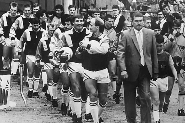 Brian Miller leads the Burnley team out at wembley for the Sherpa Van trophy final against Wolves in 1988