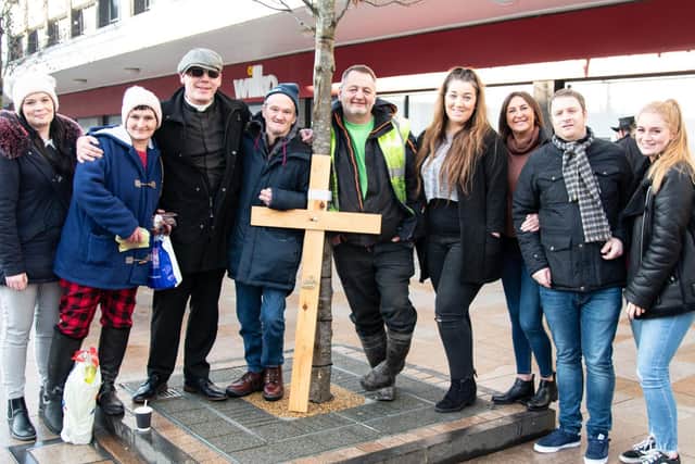 Pastor Mick Fleming (third from left) with Bethany Rawes (sixth from left) businessman Mark Hanson (fifth from left) and other helpers pictured in Burnley town centre yesterday handing our food as part of the Church on the Street ministry.