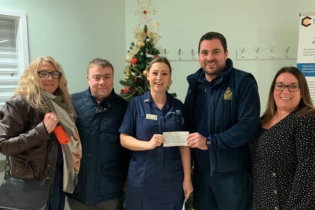 Ethan Hunt's parents, Melanie and Andrew (left) are pictured presenting the cheque to a member of staff at the ECMO unit with Mr Holding and Mrs Arcangelo. (photo by Andy Ford)