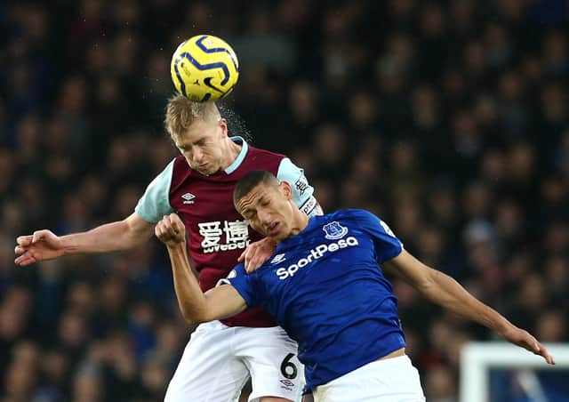LIVERPOOL, ENGLAND - DECEMBER 26: Richarlison of Everton battles for the ball with Ben Mee of Burnley during the Premier League match between Everton FC and Burnley FC at Goodison Park on December 26, 2019 in Liverpool, United Kingdom. (Photo by Jan Kruger/Getty Images)