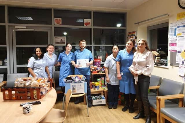 Melanie (far right) delivers food hampers to the caring staff who cared for her son, Ethan when he was struck down with sepsis last year.