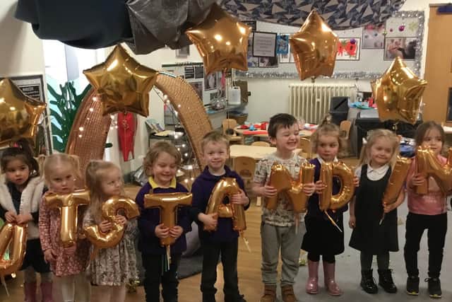 Children at Rosegrove Nursery School celebrating an 'Outstanding' Ofsted inspection