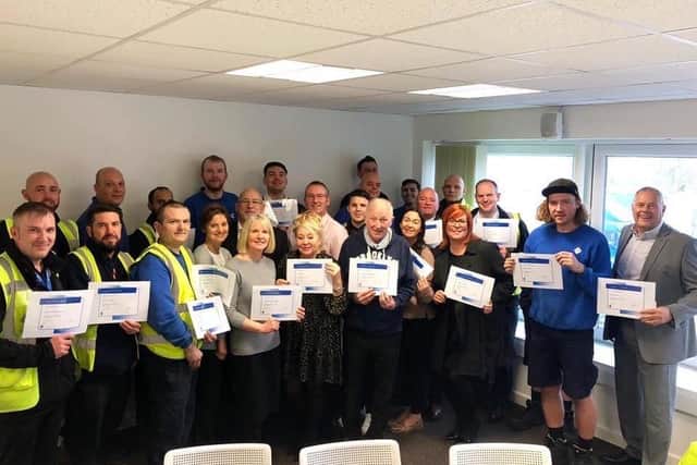 VEKA staff with their long-service certificates