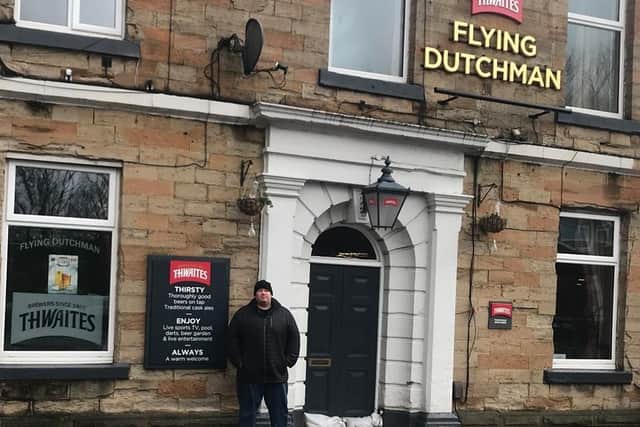 Landlord Anthony Woan outside the Flying Dutchman in Padiham which will remain closed until next week after Storm Ciara at the weekend.