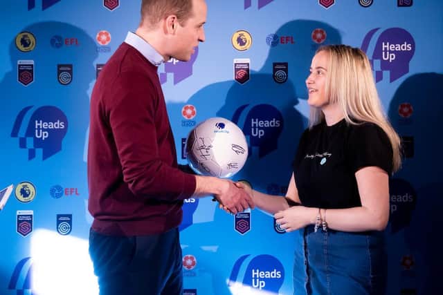 HRH the Duke of Cambridge presents Beth Hope with her signed football