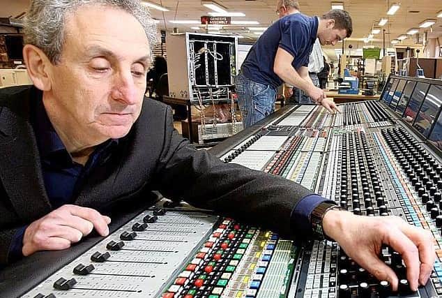 AMS Neve founder Mark Crabtree at one of the consoles