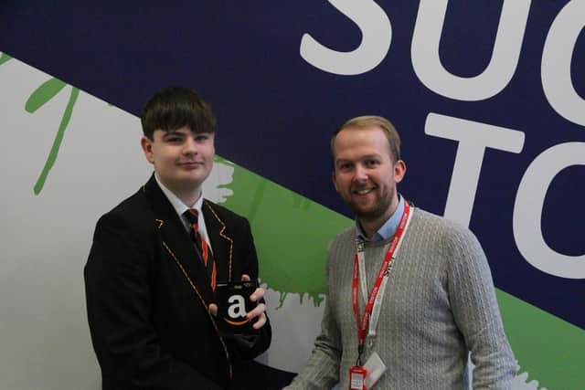 Owen, a pupil at Shuttleworth College, receiving his prize from Rapid IT operations director Chris Stevenson