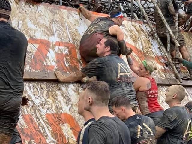 Daniel Armitage (centre) during a Tough Mudder he competed in last year