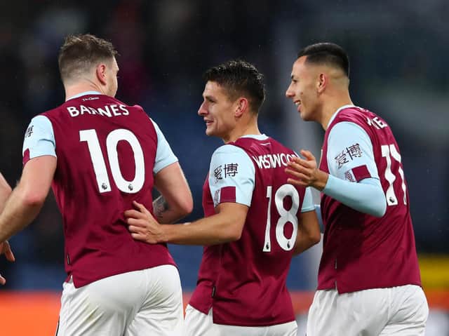 Burnley players celebrate after Roberto (out of frame) of West Ham United scores an own goal for Burnley's third goal during the Premier League match between Burnley FC and West Ham United at Turf Moor on November 09, 2019 in Burnley, United Kingdom. (Photo by Clive Brunskill/Getty Images)